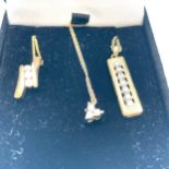 Three 9ct yellow gold pendant and chains, set with small round brilliant cut diamonds, total