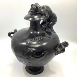 A patinated bronze urn emblematic of 'sorrow,' with lamenting maiden kneeling with head in hands,