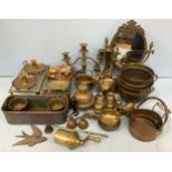 Two trays of brassware including elephant claw bells, trivets, elephant statues, planters, candle