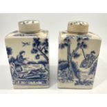 A pair of European pottery tea canisters of square form, decorated with romantic scenes of a man