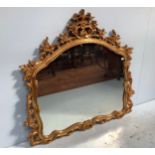 A Giltwood over-mantel mirror in the Rococo style, 115x115cm