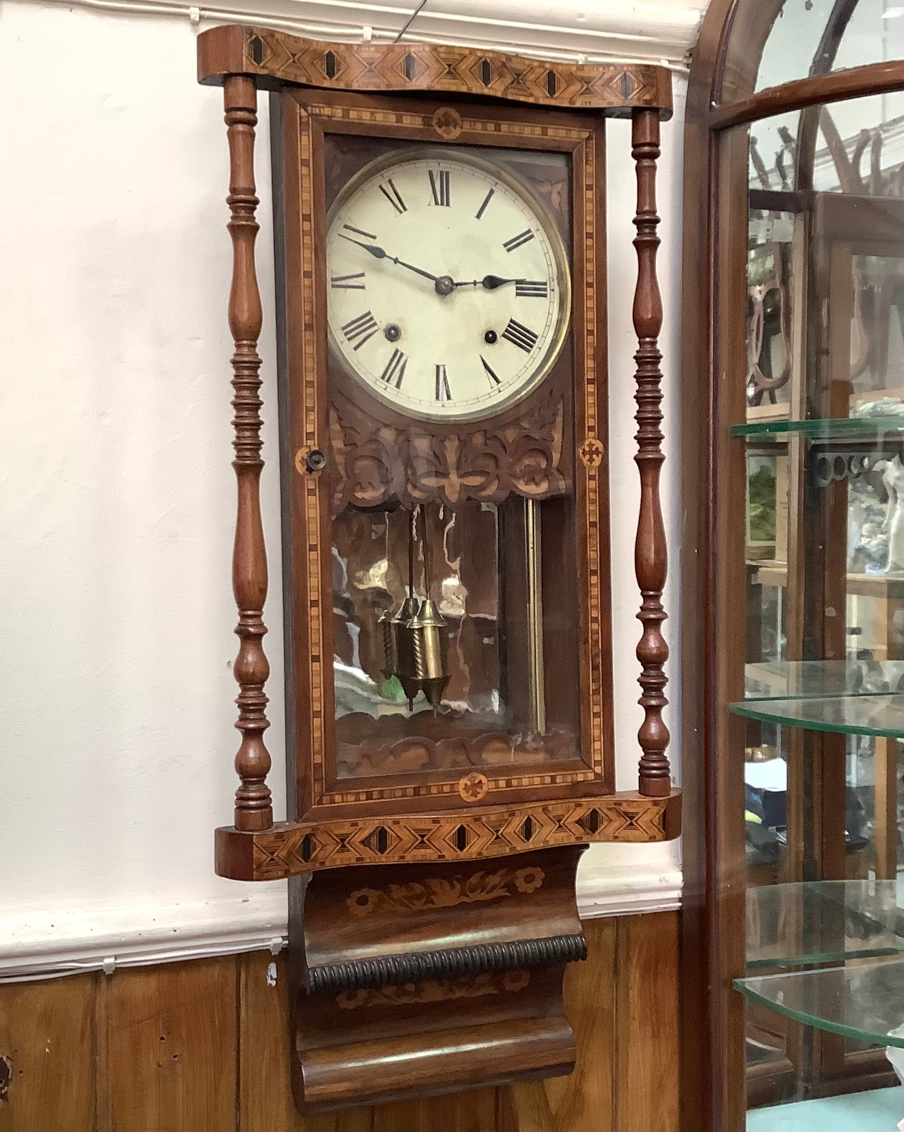 A 19th century wall clock with parquetry inlaid case, rectangular form with circular dial, brass