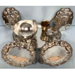 A good quality pair of silver-plated tureens with warmers. the top with relief moulded floral and