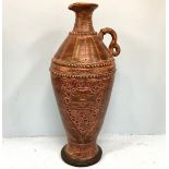 A large brown pottery vase with incised geometric decoration, approx. 60cm high