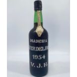 A bottle of Justino's Madeira Wine Verdelho 1954, 19% volume, bottled & shipped for Vinhos Justino
