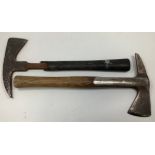 Two WW2 fireman's axes, one with wooden handle and one with rubber-coated handle, (2)