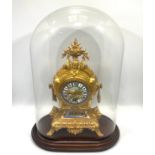 A gilt metal and porcelain mounted mantel clock, the dial painted with a scene of a house by water