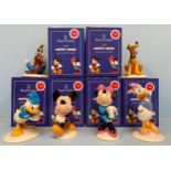 A set of six Royal Doulton ceramic figures from the Mickey Mouse Collection celebrating 70 years