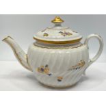 An 18th century Worcester porcelain teapot with spiral moulded body, decorated with gilt highlighted