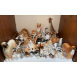 A collection of approximately 40 Russian ceramic animal figures in varying sizes including giraffes,