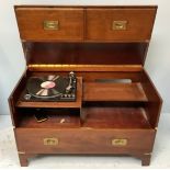 A mahogany 'military campaign chest' enclosing a music turntable, hinged top with two short faux