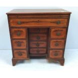 A George III inlaid mahogany bachelor's kneehole desk, of small proportions, with pull out