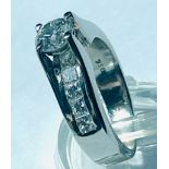 A platinum solitaire ring set with a round brilliant cut diamond to the centre, H colour, SI