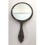 An finely embossed and chased silver hand-mirror, in the Art Nouveau style, with central vignette of