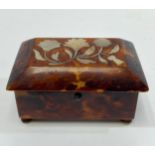 A 19th century tortoiseshell, mother-of-pearl and ivory mounted miniature casket, 65mm wide