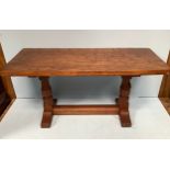 A Robert 'Mouseman' Thompson adzed oak coffee table with baluster trestle supports, carved mouse and