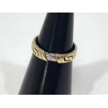 A gent's 14ct gold ring set with a small diamond and pierced sides, 2.5g, ring size M