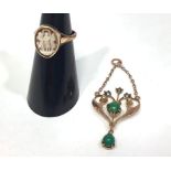 An Edwardian 9ct gold necklace pendant of open heart shape design set with seed pearls and green