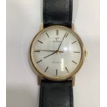 A gents 9ct gold cased Omega Geneve wristwatch, the silvered dial with batons denoting hours and