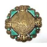 A 1930s gilt metal Chinese style shaped circular brooch probably by Max Neiger (brothers), with
