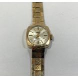 A 9ct yellow gold ladies Roamer wristwatch, gold coloured batons denoting the numbers, champagne