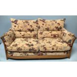 An Ercol 'Renaissance' beech and elm two seater sofa, with fitted fabric upholstered cushions in