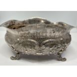 A 19th Century oval silver bowl, with chased and embossed repousse scrollwork and floral decoration,