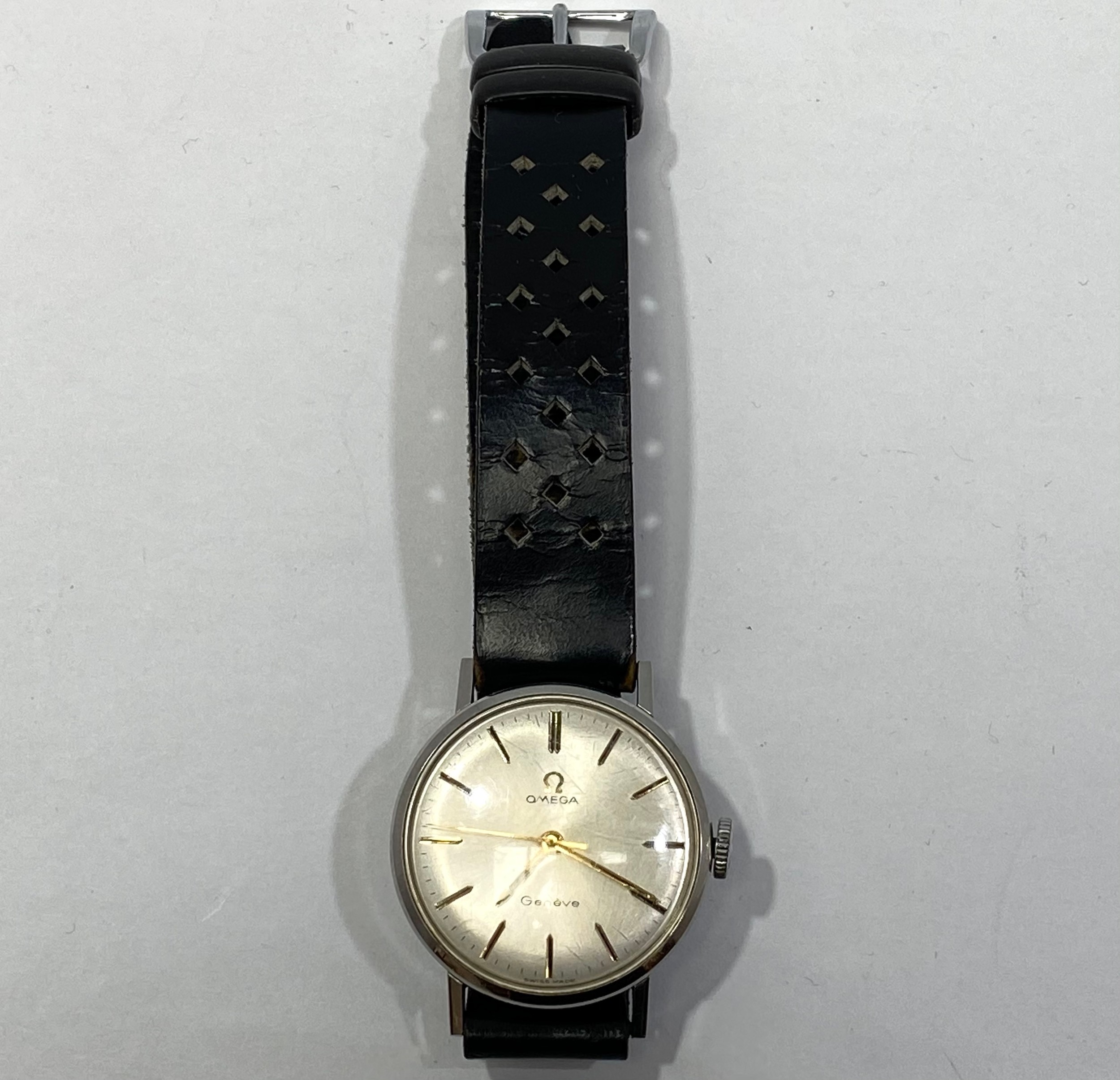 A stainless steel manual wind Omega Geneve wristwatch, the silvered dial with applied gold batons