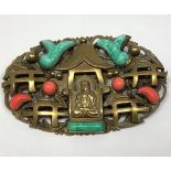 A 1930s gilt metal Chinese style shaped oval brooch probably by Max Neiger (brothers), central