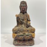 An 17th/18th century finely carved wood, gesso and polychrome seated Bodhisattva, modelled with a