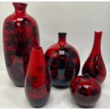 Five various Royal Doulton flambe vases including a large vase decorated with stags marked Woodcut