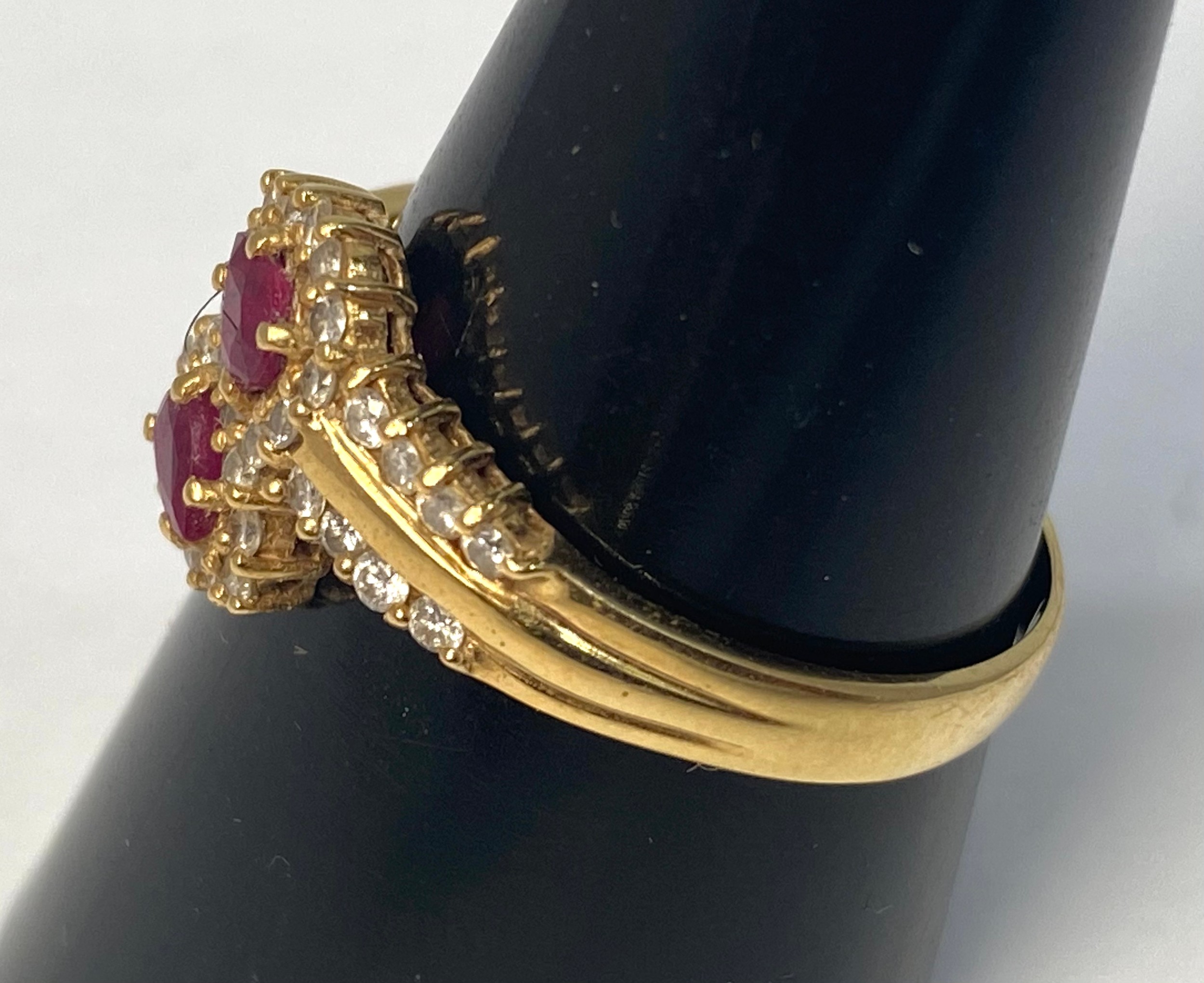 An 18ct gold ruby and diamond ring, set with 2 x pear shaped rubies and 38 x small round brilliant - Bild 2 aus 4