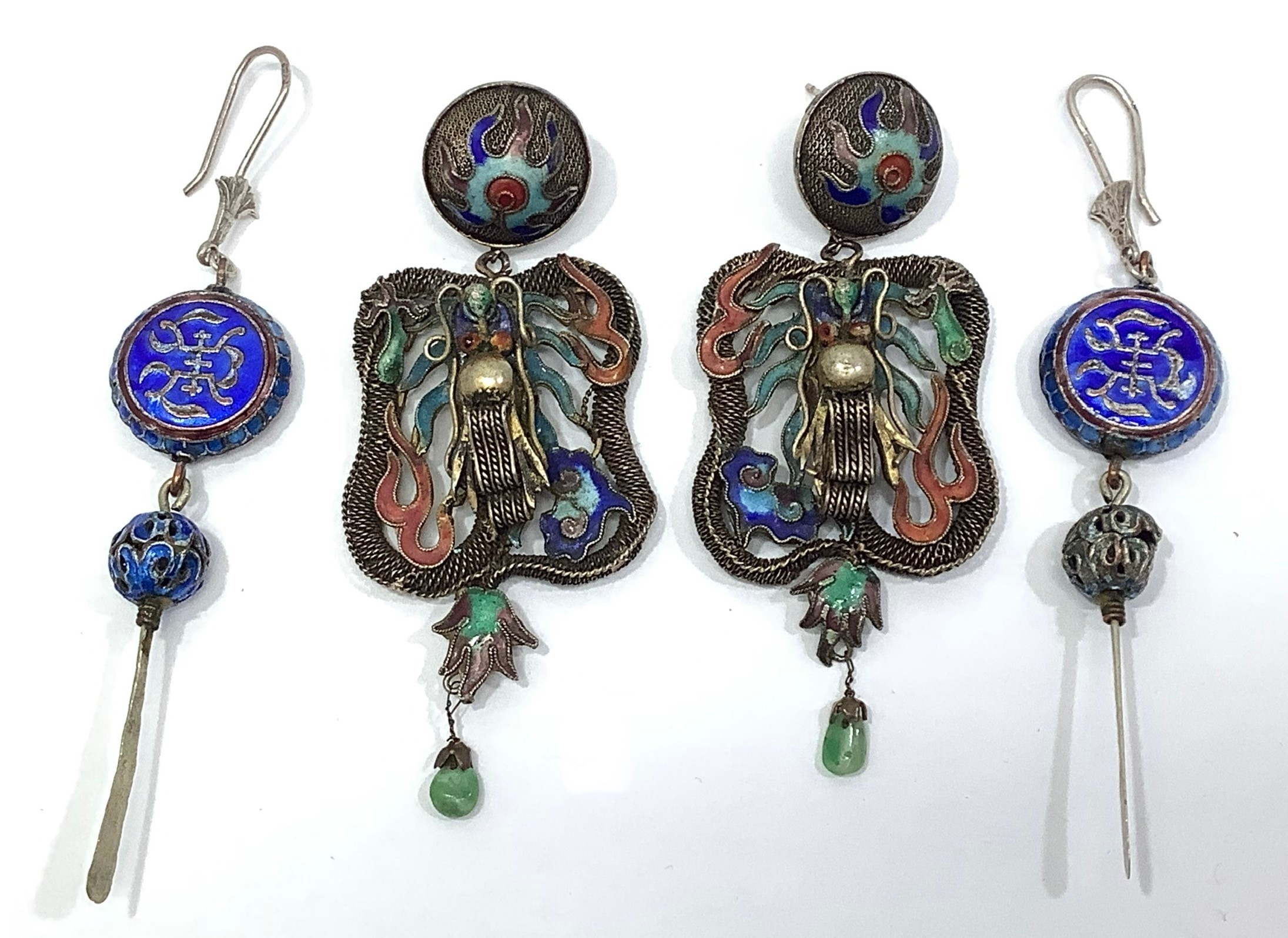 A large pair of Chinese earrings with circular cloisonné enamel flaming pearl tops suspending panels