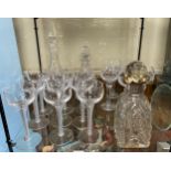 A set of nine Stuart glass wine goblets with double-series air-twist stems, five cut-glass