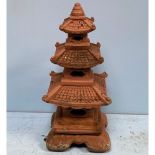 A five section reconstituted stone pagoda, painted in typical terracotta colour, 110cm tall (AF)