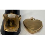 A 9ct gold locket, and a 9ct framed large Smokey quartz ring, finger size U, total weight 14.6