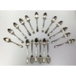 Twelve French silver small dessertspoons with scrolling foliate cartouche handles and six similar