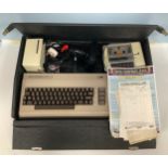 A Commodore 64 games console with cassette deck, joystick, carry case and sixteen games including