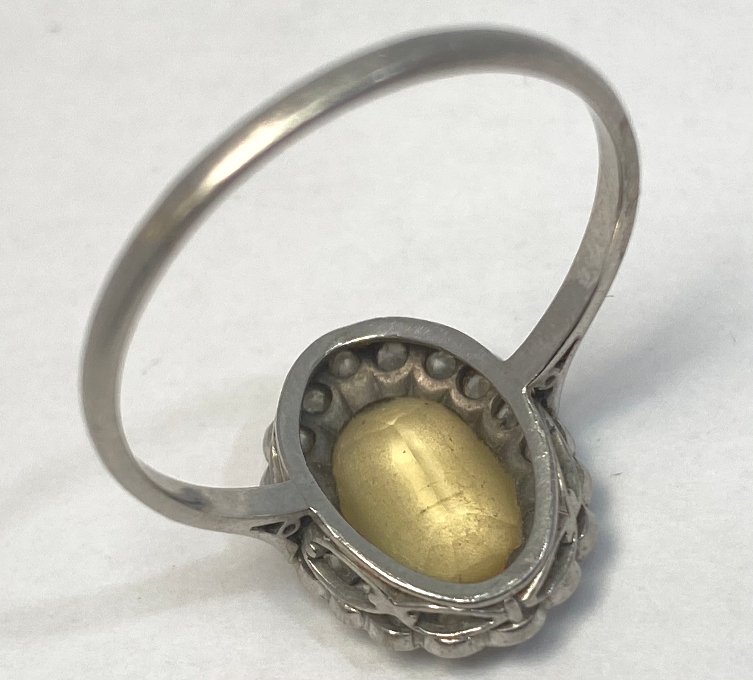 A platinum dress ring set with an oval citrine to the centre, surrounded by 18 x small diamonds in a - Bild 2 aus 5