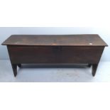 A late 17th/early 18th century stained oak sword chest, the hinged top enclosing storage space and