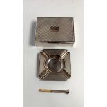 An Indian silver presentation silver cigarette box, the trellis embossed hinged cover engraved