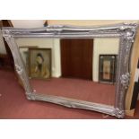 A large ornate rectangular silver framed mirror (af), 120 x 150cm