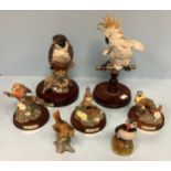 Seven assorted ceramic and resin figures of birds including a Royal Doulton 'Peregrine Falcon H.N.