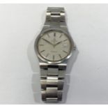 A gents stainless steel Omega Genève wristwatch, the silvered dial with batons denoting hours and