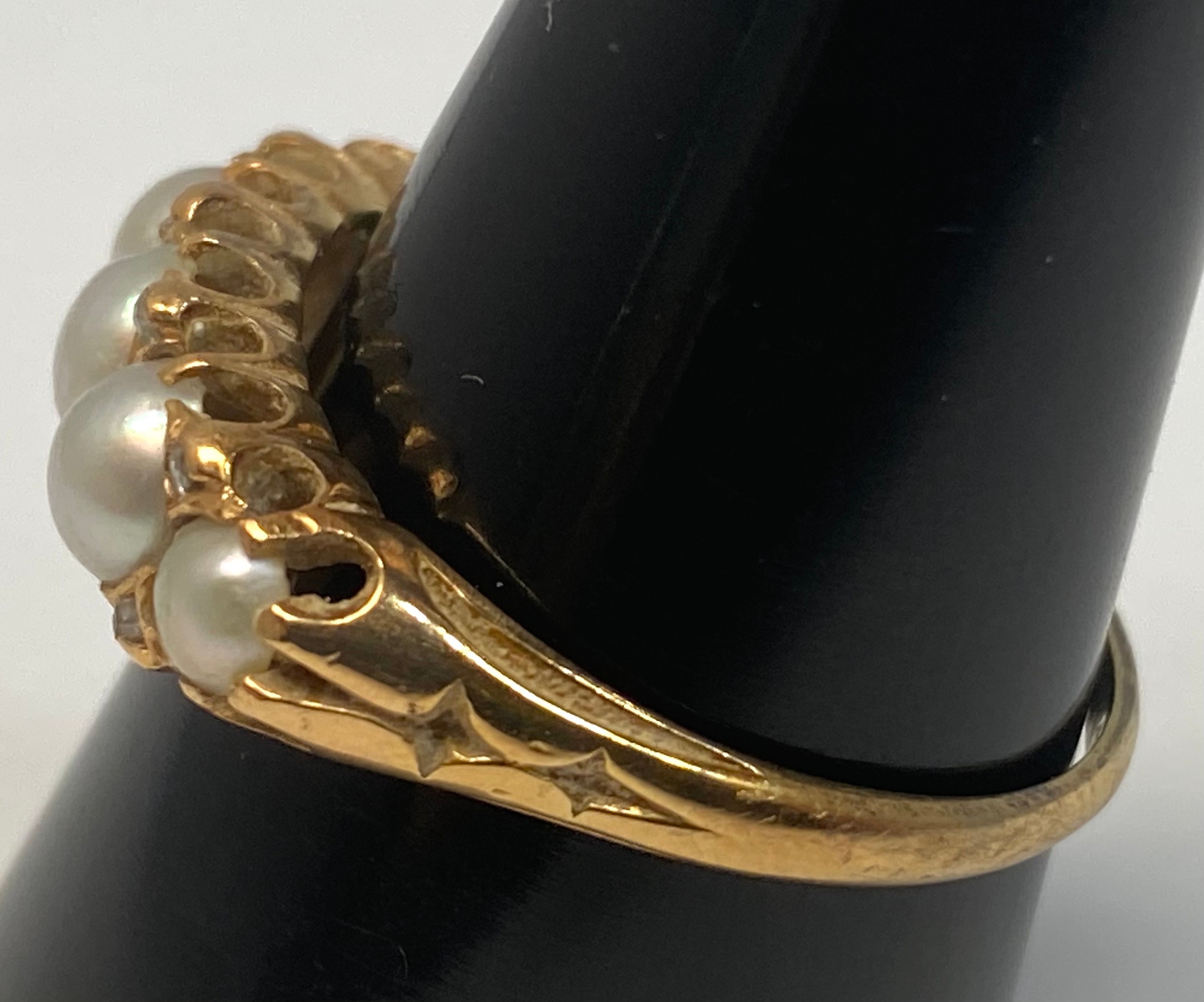 A 9ct gold ring set with five graduated blister-pearls, and 8 x small eight-cut diamonds in a carved - Bild 2 aus 4