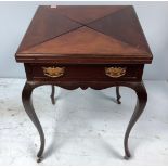 An Edwardian stained walnut envelope card table, on cabriole supports, 56cm square