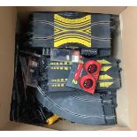 A large quantity of SCX slot car racing track, controllers and accessories including crash barriers,