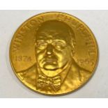 A 22ct gold commemorative medal, Sir Winston Churchill by John Pinches, signed L.E. Pinches, with