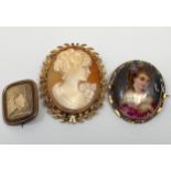 A 9ct gold shell carved cameo depicting a female bust facing left with flower on her shoulder,