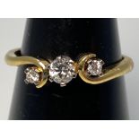 An 18ct yellow gold three stone diamond ring, H colour, VS1 clarity, total diamond weight 0.23cts,